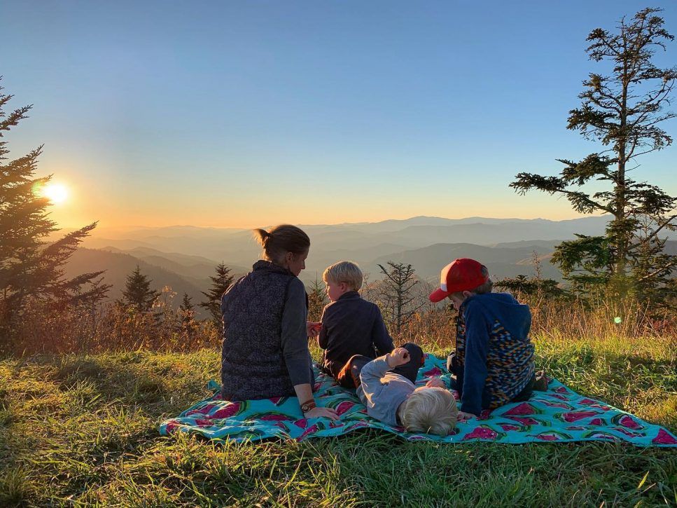 family enjoying a sunset at Waterrock Knob.