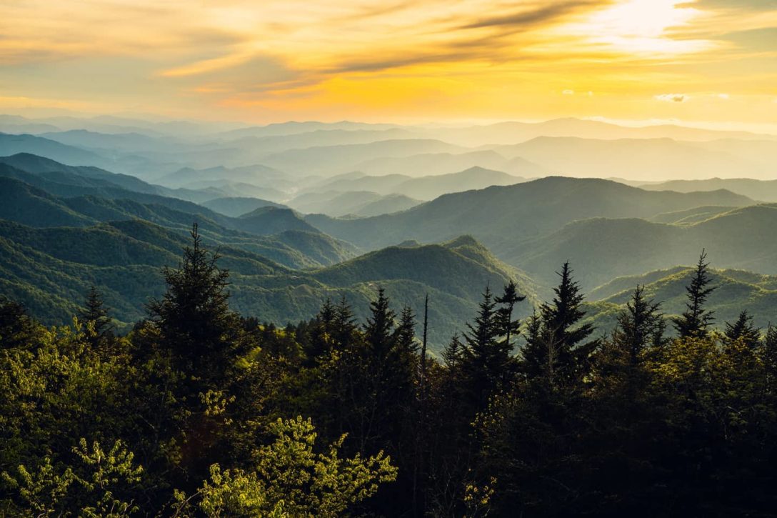 photo of mountain scene during sunset